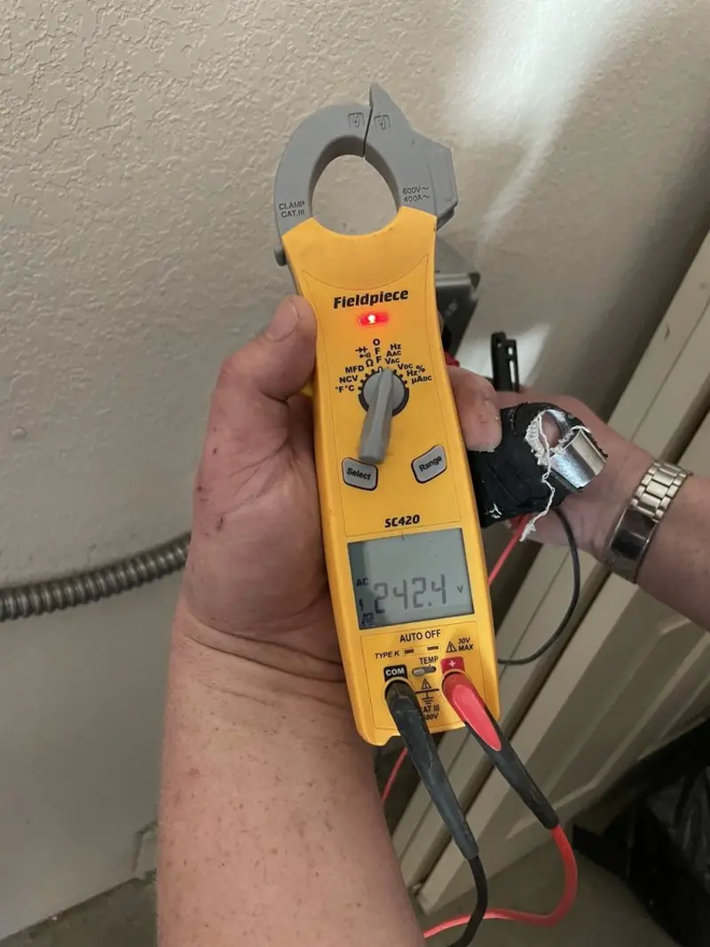 Voltage testing with clamp meter during Circuit Breaker Repair in Centre